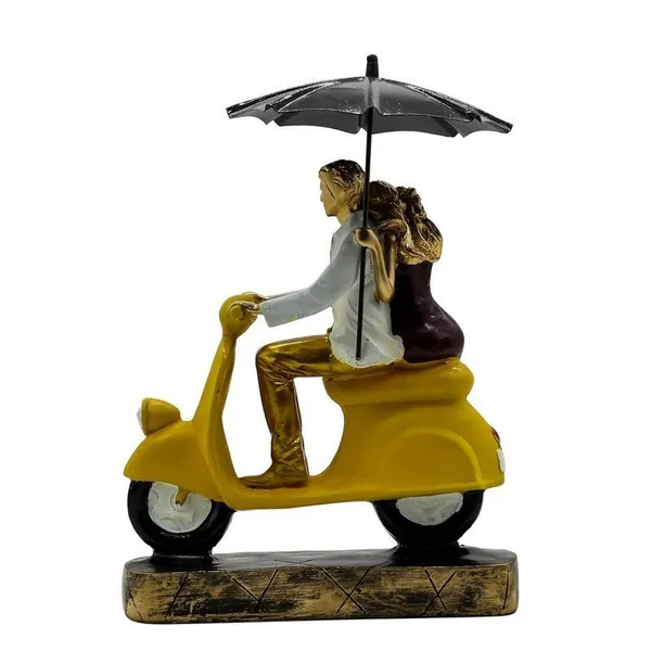 Romantic_Couple_Riding_Yellow_Scooter_Statue_-_A_Symbol_of_Love_and_Adventure