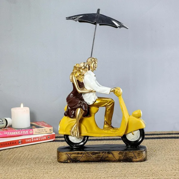 Romantic_Couple_Riding_Yellow_Scooter_Statue_-_A_Symbol_of_Love_and_Adventure