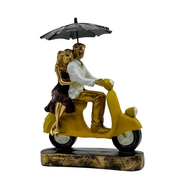 Romantic_Couple_Riding_Yellow_Scooter_Statue_-_A_Symbol_of_Love_and_Adventure