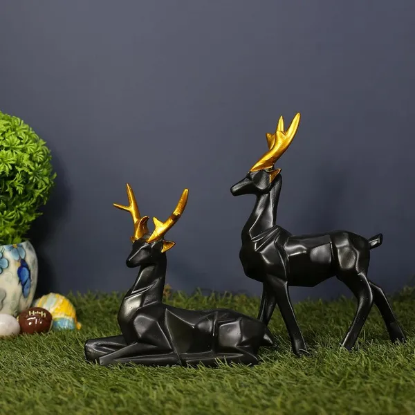 Elegant_Black_Deer_Statues_with_Golden_Antlers_-_Perfect_Home_Decor_for_Modern_Living_Spaces