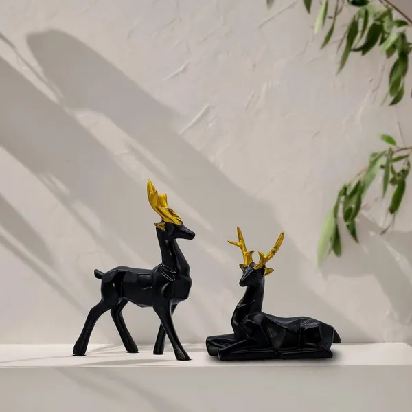 Elegant_Black_Deer_Statues_with_Golden_Antlers_-_Perfect_Home_Decor_for_Modern_Living_Spaces