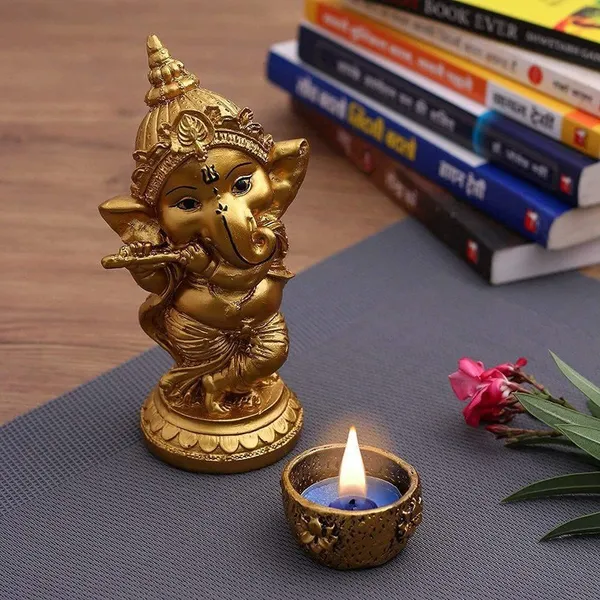 Ganesha_Playing_Flute_Idol_with_Decorative_Tealight_Diya_Gold_Finish_Ganpati_Statue_for_Home,_Office_&_Pooja_Room_Decor_(6_Inch)