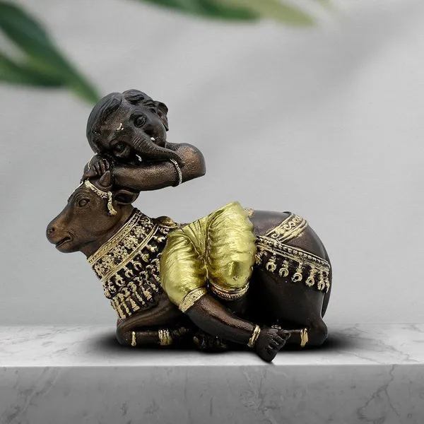 Baby_Ganesha_Idol_Resting_on_Cow_Antique_Finish_Polyresin_Ganpati_Murti_with_Golden_Dhoti_for_Home_Decor,_Pooja_Room_&_Gift,_6_Inch