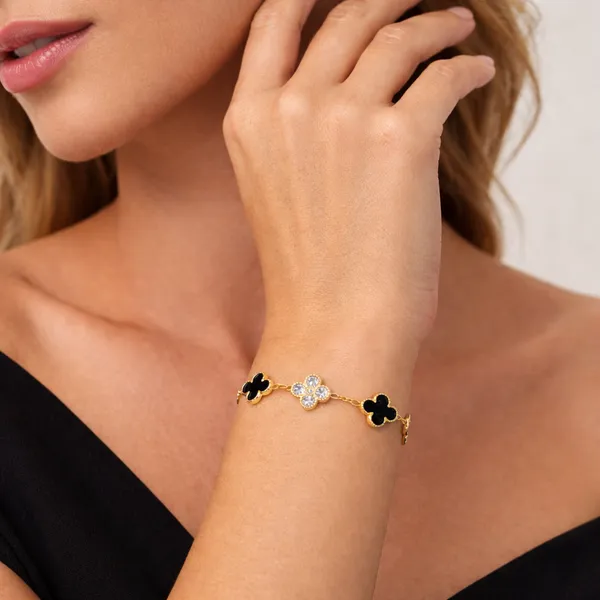 Ridhvee_Anti-Tarnish_Gold_Plated_Clover_Charm_Bracelet_For_Women_&_Girls_|_Black_&_White_Floral_Clover_Design_|_Adjustable_Chain_|_Skin_Friendly_Lightweight_Fashion_Jewellery_|_Rv-At-Brc-009