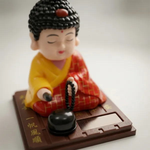 Solar_Powered_Nodding_Buddha_–_Zen_Desk_&_Car_Dashboard_Decor