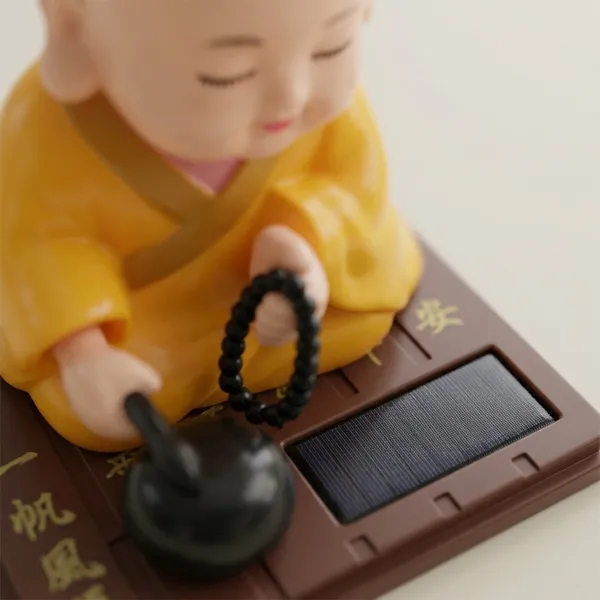 Solar_Powered_Nodding_Buddha_–_Zen_Desk_&_Car_Dashboard_Decor