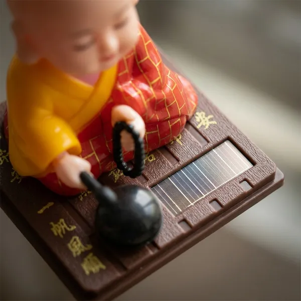 Solar_Powered_Nodding_Buddha_–_Zen_Desk_&_Car_Dashboard_Decor