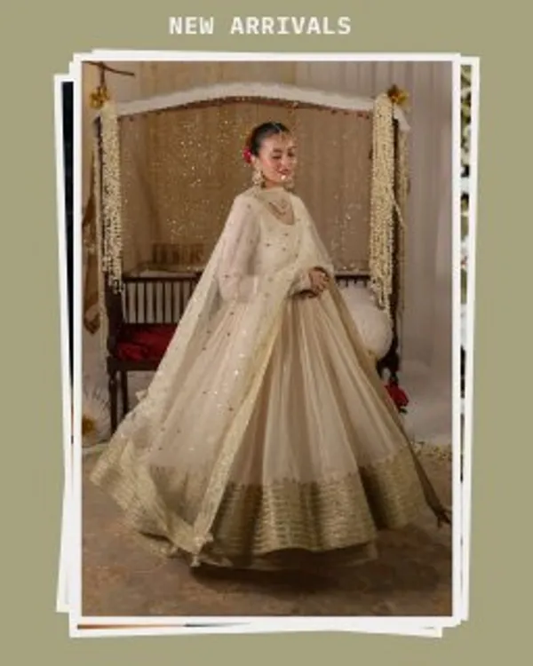 Elegant_Off_White_Anarkali_Salwar_Suit_With_Golden_Embellished_Border