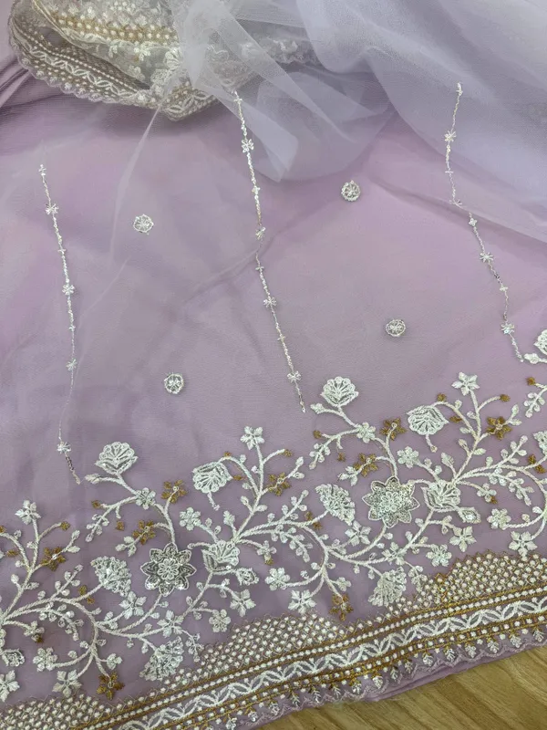 Lavender_Embroidered_Saree_With_Silver_Embellishments_And_White_Tassel_Clutch