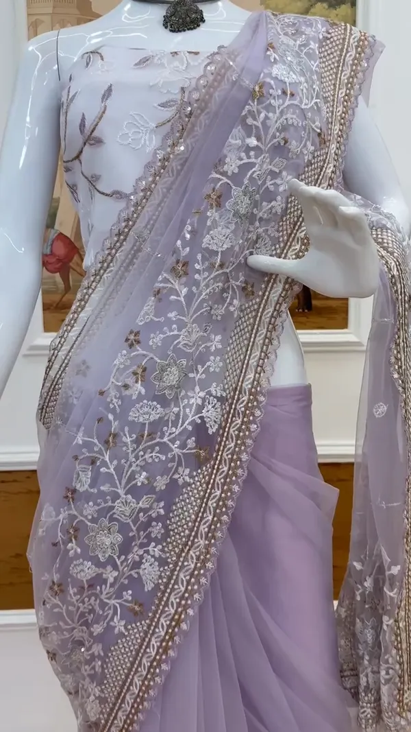 Lavender_Embroidered_Saree_With_Silver_Embellishments_And_White_Tassel_Clutch