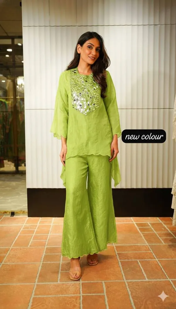 Beautiful_Heavy_quality_Tebby_Silk_Fabric_designer_festive_wear_2pc_Cord_Set_with_Semi-Bell_Sleeves_&_Crape_Lining._Paired_with_Coded_Embroidery_&_original_mirror_work_on_yoke_&_Arkha_Work