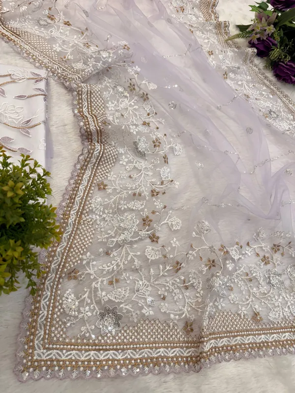 Lavender_Embroidered_Saree_With_Silver_Embellishments_And_White_Tassel_Clutch