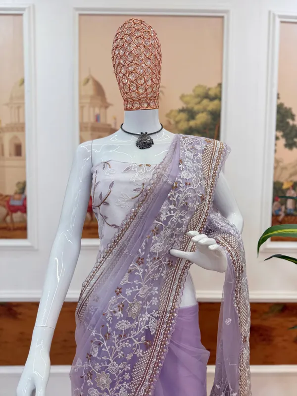 Lavender_Embroidered_Saree_With_Silver_Embellishments_And_White_Tassel_Clutch