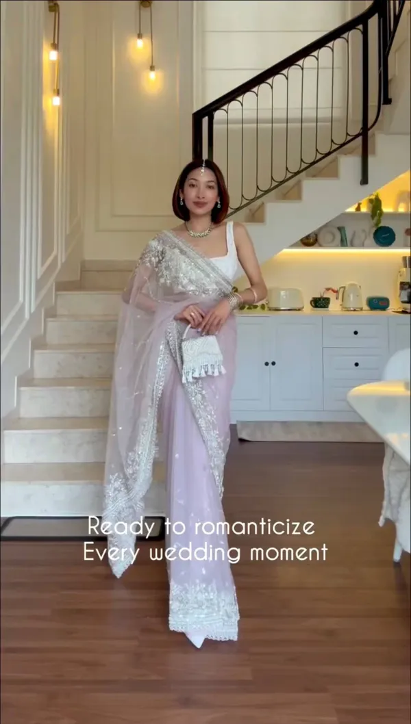 Lavender_Embroidered_Saree_With_Silver_Embellishments_And_White_Tassel_Clutch