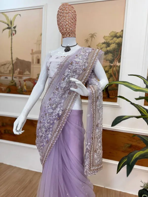 Lavender_Embroidered_Saree_With_Silver_Embellishments_And_White_Tassel_Clutch
