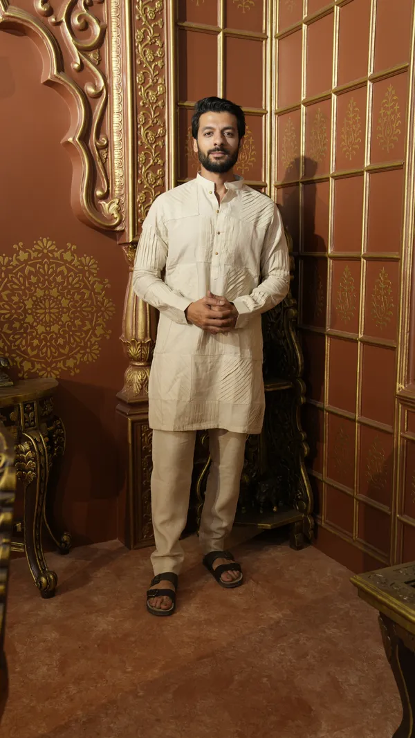 BEIGE_LINEN_SOLID_PLEATED_REGULAR_FIT_DESIGNER_KURTA_SET
