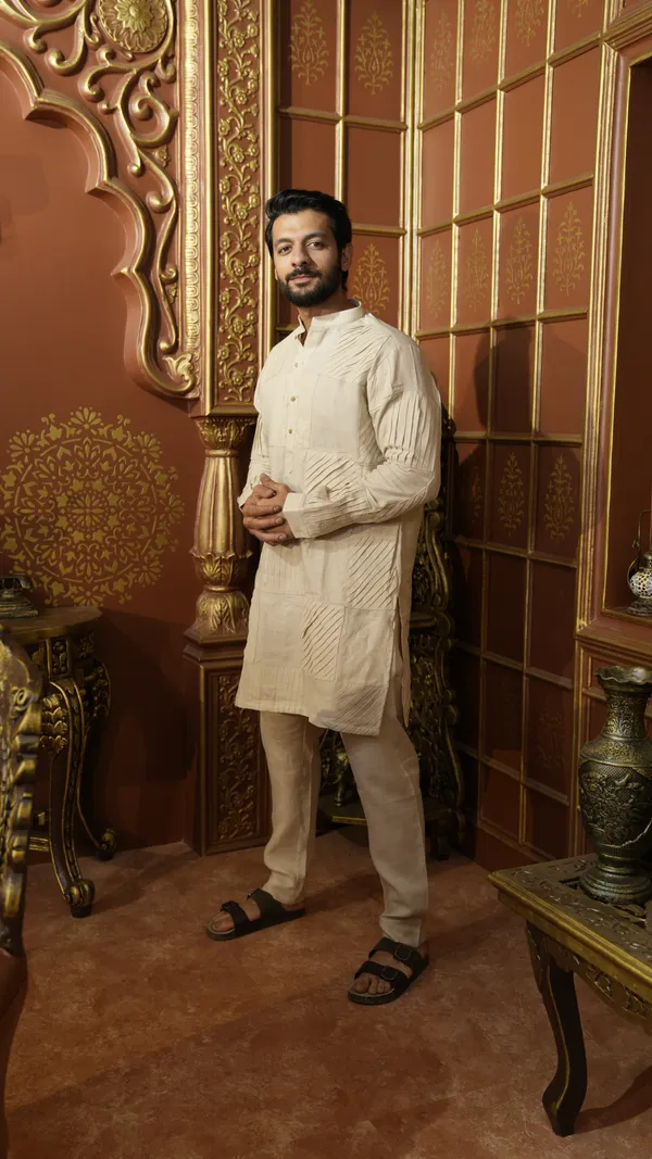 BEIGE_LINEN_SOLID_PLEATED_REGULAR_FIT_DESIGNER_KURTA_SET