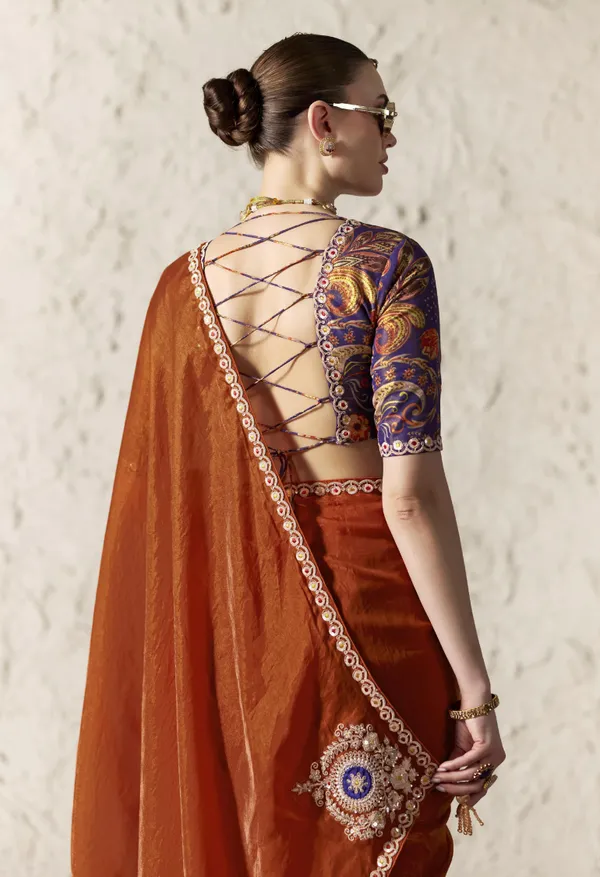 AN_EMBODIMENT_OF_UNDERSTATED_LUXURY,_THIS_SAREE_FEATURES_A_FLUID_DRAPE_AND_SOFT,_LUMINOUS_FINISH_,_ITS_ELEGANT_TEXTURE_AND_REFINED_CRFTSMANSHIP_CREATE_A_SILHOUETTE_THAT_IS_EFFORTLESSLY_GRACEFUL_PREFECT_FOR_BOTH_GRAND_OCCASIONS_AND_INTIMATE_CELEBRATION