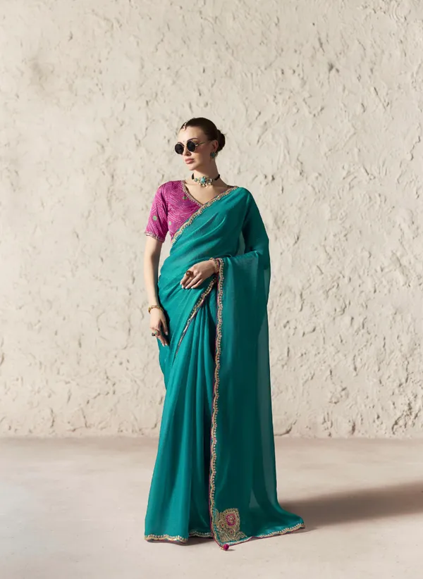 AN_EMBODIMENT_OF_UNDERSTATED_LUXURY,_THIS_SAREE_FEATURES_A_FLUID_DRAPE_AND_SOFT,_LUMINOUS_FINISH_,_ITS_ELEGANT_TEXTURE_AND_REFINED_CRFTSMANSHIP_CREATE_A_SILHOUETTE_THAT_IS_EFFORTLESSLY_GRACEFUL_PREFECT_FOR_BOTH_GRAND_OCCASIONS_AND_INTIMATE_CELEBRATION
