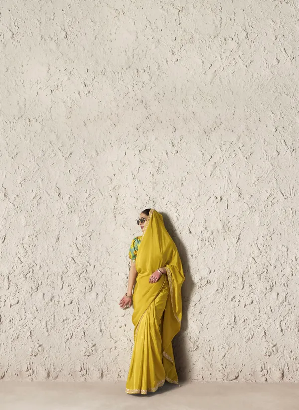 AN_EMBODIMENT_OF_UNDERSTATED_LUXURY,_THIS_SAREE_FEATURES_A_FLUID_DRAPE_AND_SOFT,_LUMINOUS_FINISH_,_ITS_ELEGANT_TEXTURE_AND_REFINED_CRFTSMANSHIP_CREATE_A_SILHOUETTE_THAT_IS_EFFORTLESSLY_GRACEFUL_PREFECT_FOR_BOTH_GRAND_OCCASIONS_AND_INTIMATE_CELEBRATION