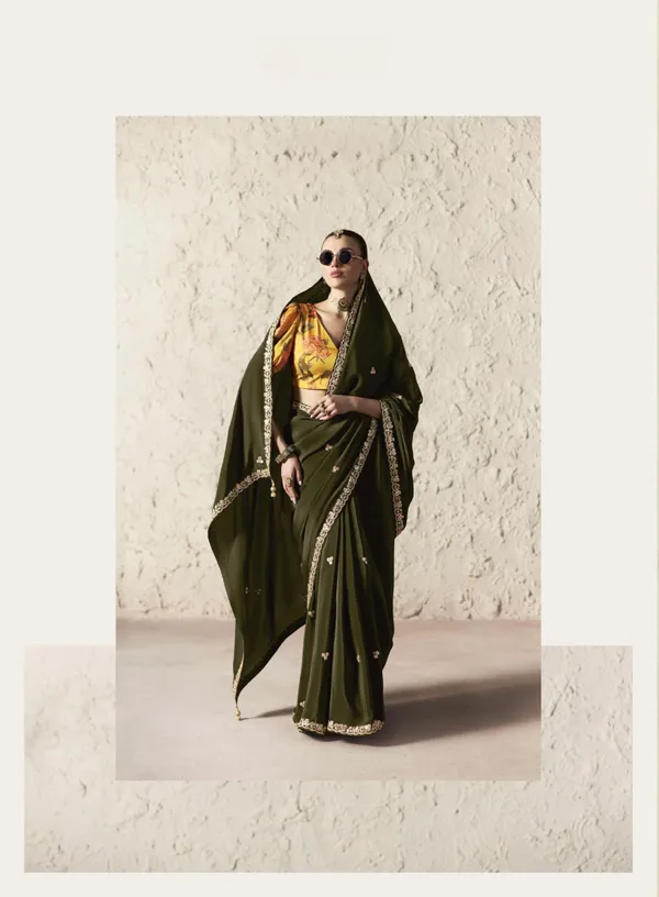 AN_EMBODIMENT_OF_UNDERSTATED_LUXURY,_THIS_SAREE_FEATURES_A_FLUID_DRAPE_AND_SOFT,_LUMINOUS_FINISH_,_ITS_ELEGANT_TEXTURE_AND_REFINED_CRFTSMANSHIP_CREATE_A_SILHOUETTE_THAT_IS_EFFORTLESSLY_GRACEFUL_PREFECT_FOR_BOTH_GRAND_OCCASIONS_AND_INTIMATE_CELEBRATION