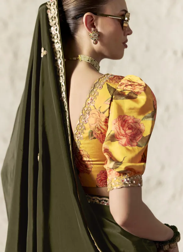 AN_EMBODIMENT_OF_UNDERSTATED_LUXURY,_THIS_SAREE_FEATURES_A_FLUID_DRAPE_AND_SOFT,_LUMINOUS_FINISH_,_ITS_ELEGANT_TEXTURE_AND_REFINED_CRFTSMANSHIP_CREATE_A_SILHOUETTE_THAT_IS_EFFORTLESSLY_GRACEFUL_PREFECT_FOR_BOTH_GRAND_OCCASIONS_AND_INTIMATE_CELEBRATION