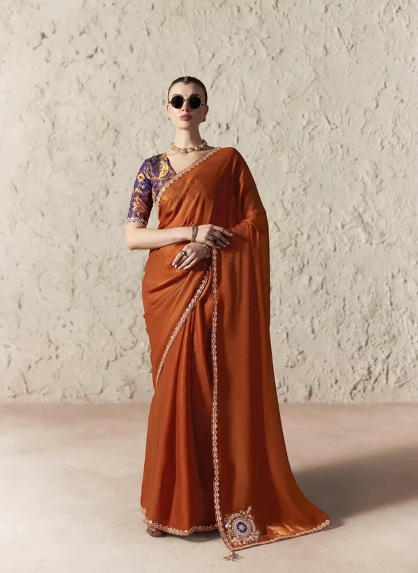 AN_EMBODIMENT_OF_UNDERSTATED_LUXURY,_THIS_SAREE_FEATURES_A_FLUID_DRAPE_AND_SOFT,_LUMINOUS_FINISH_,_ITS_ELEGANT_TEXTURE_AND_REFINED_CRFTSMANSHIP_CREATE_A_SILHOUETTE_THAT_IS_EFFORTLESSLY_GRACEFUL_PREFECT_FOR_BOTH_GRAND_OCCASIONS_AND_INTIMATE_CELEBRATION