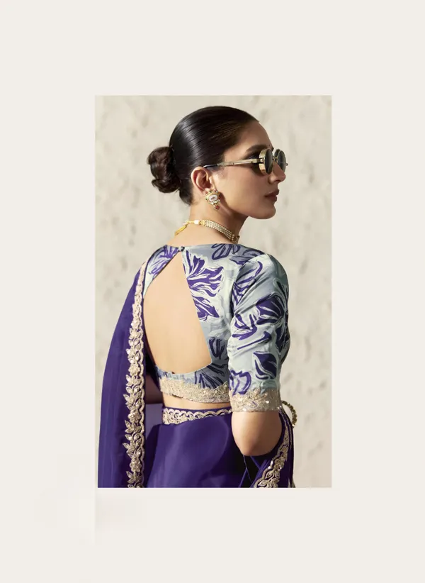 AN_EMBODIMENT_OF_UNDERSTATED_LUXURY,_THIS_SAREE_FEATURES_A_FLUID_DRAPE_AND_SOFT,_LUMINOUS_FINISH_,_ITS_ELEGANT_TEXTURE_AND_REFINED_CRFTSMANSHIP_CREATE_A_SILHOUETTE_THAT_IS_EFFORTLESSLY_GRACEFUL_PREFECT_FOR_BOTH_GRAND_OCCASIONS_AND_INTIMATE_CELEBRATION