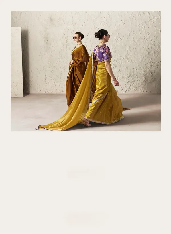 AN_EMBODIMENT_OF_UNDERSTATED_LUXURY,_THIS_SAREE_FEATURES_A_FLUID_DRAPE_AND_SOFT,_LUMINOUS_FINISH_,_ITS_ELEGANT_TEXTURE_AND_REFINED_CRFTSMANSHIP_CREATE_A_SILHOUETTE_THAT_IS_EFFORTLESSLY_GRACEFUL_PREFECT_FOR_BOTH_GRAND_OCCASIONS_AND_INTIMATE_CELEBRATION
