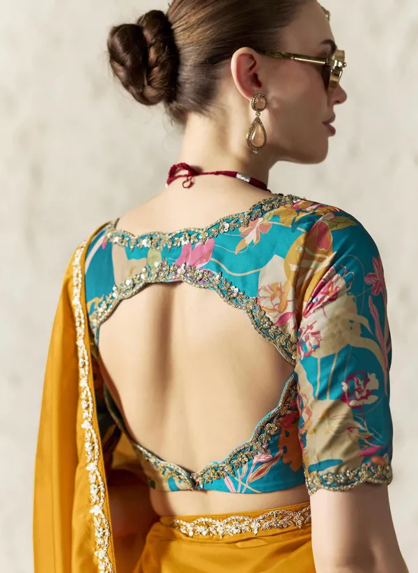 AN_EMBODIMENT_OF_UNDERSTATED_LUXURY,_THIS_SAREE_FEATURES_A_FLUID_DRAPE_AND_SOFT,_LUMINOUS_FINISH_,_ITS_ELEGANT_TEXTURE_AND_REFINED_CRFTSMANSHIP_CREATE_A_SILHOUETTE_THAT_IS_EFFORTLESSLY_GRACEFUL_PREFECT_FOR_BOTH_GRAND_OCCASIONS_AND_INTIMATE_CELEBRATION