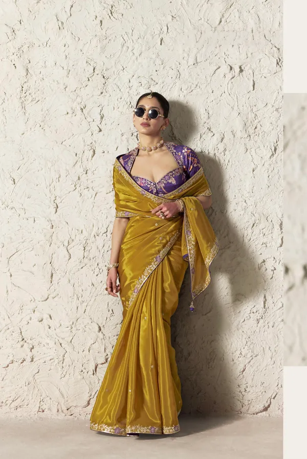 AN_EMBODIMENT_OF_UNDERSTATED_LUXURY,_THIS_SAREE_FEATURES_A_FLUID_DRAPE_AND_SOFT,_LUMINOUS_FINISH_,_ITS_ELEGANT_TEXTURE_AND_REFINED_CRFTSMANSHIP_CREATE_A_SILHOUETTE_THAT_IS_EFFORTLESSLY_GRACEFUL_PREFECT_FOR_BOTH_GRAND_OCCASIONS_AND_INTIMATE_CELEBRATION