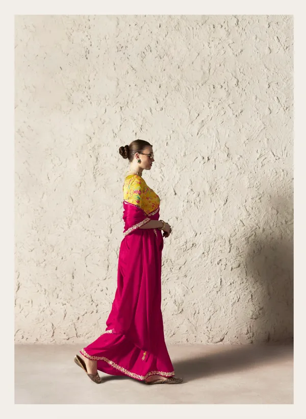 AN_EMBODIMENT_OF_UNDERSTATED_LUXURY,_THIS_SAREE_FEATURES_A_FLUID_DRAPE_AND_SOFT,_LUMINOUS_FINISH_,_ITS_ELEGANT_TEXTURE_AND_REFINED_CRFTSMANSHIP_CREATE_A_SILHOUETTE_THAT_IS_EFFORTLESSLY_GRACEFUL_PREFECT_FOR_BOTH_GRAND_OCCASIONS_AND_INTIMATE_CELEBRATION