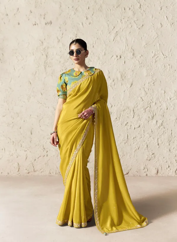 AN_EMBODIMENT_OF_UNDERSTATED_LUXURY,_THIS_SAREE_FEATURES_A_FLUID_DRAPE_AND_SOFT,_LUMINOUS_FINISH_,_ITS_ELEGANT_TEXTURE_AND_REFINED_CRFTSMANSHIP_CREATE_A_SILHOUETTE_THAT_IS_EFFORTLESSLY_GRACEFUL_PREFECT_FOR_BOTH_GRAND_OCCASIONS_AND_INTIMATE_CELEBRATION