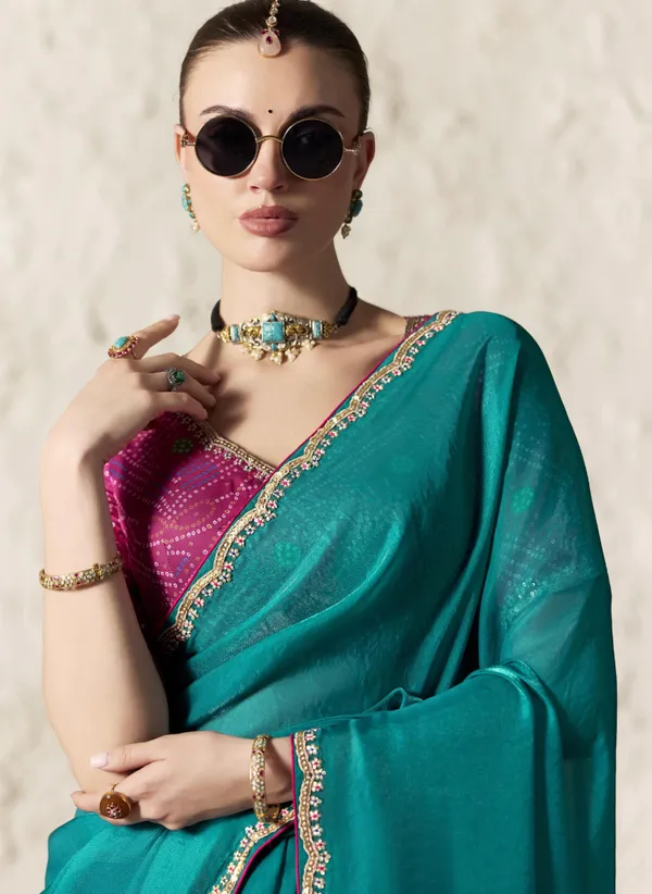 AN_EMBODIMENT_OF_UNDERSTATED_LUXURY,_THIS_SAREE_FEATURES_A_FLUID_DRAPE_AND_SOFT,_LUMINOUS_FINISH_,_ITS_ELEGANT_TEXTURE_AND_REFINED_CRFTSMANSHIP_CREATE_A_SILHOUETTE_THAT_IS_EFFORTLESSLY_GRACEFUL_PREFECT_FOR_BOTH_GRAND_OCCASIONS_AND_INTIMATE_CELEBRATION
