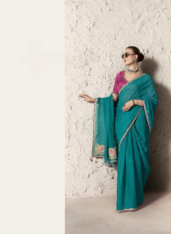 AN_EMBODIMENT_OF_UNDERSTATED_LUXURY,_THIS_SAREE_FEATURES_A_FLUID_DRAPE_AND_SOFT,_LUMINOUS_FINISH_,_ITS_ELEGANT_TEXTURE_AND_REFINED_CRFTSMANSHIP_CREATE_A_SILHOUETTE_THAT_IS_EFFORTLESSLY_GRACEFUL_PREFECT_FOR_BOTH_GRAND_OCCASIONS_AND_INTIMATE_CELEBRATION