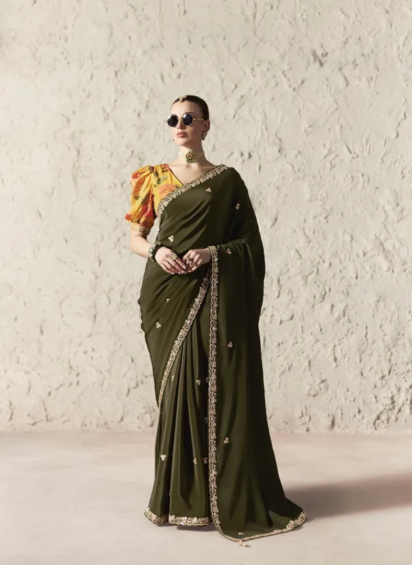 AN_EMBODIMENT_OF_UNDERSTATED_LUXURY,_THIS_SAREE_FEATURES_A_FLUID_DRAPE_AND_SOFT,_LUMINOUS_FINISH_,_ITS_ELEGANT_TEXTURE_AND_REFINED_CRFTSMANSHIP_CREATE_A_SILHOUETTE_THAT_IS_EFFORTLESSLY_GRACEFUL_PREFECT_FOR_BOTH_GRAND_OCCASIONS_AND_INTIMATE_CELEBRATION