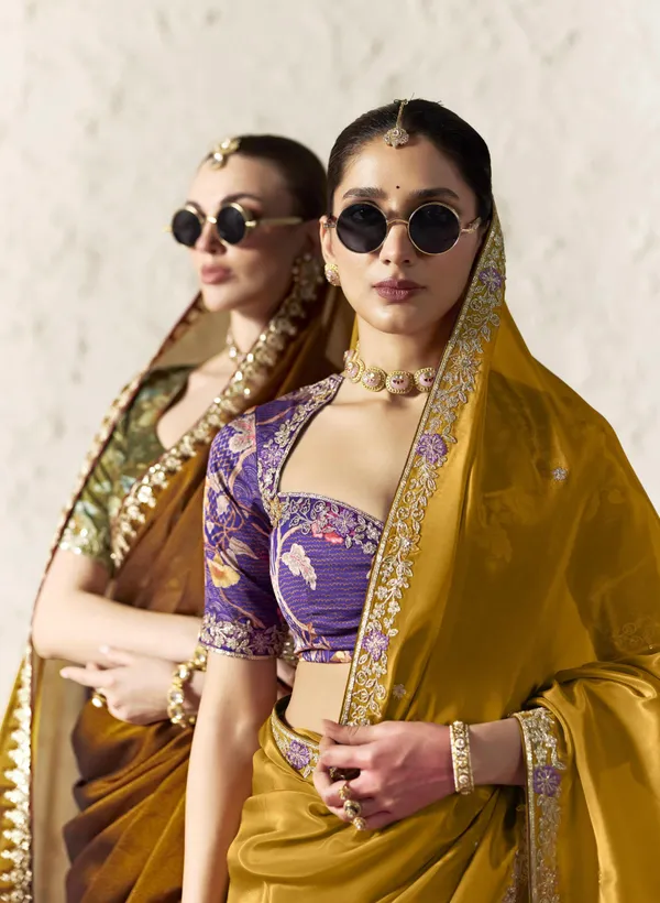 AN_EMBODIMENT_OF_UNDERSTATED_LUXURY,_THIS_SAREE_FEATURES_A_FLUID_DRAPE_AND_SOFT,_LUMINOUS_FINISH_,_ITS_ELEGANT_TEXTURE_AND_REFINED_CRFTSMANSHIP_CREATE_A_SILHOUETTE_THAT_IS_EFFORTLESSLY_GRACEFUL_PREFECT_FOR_BOTH_GRAND_OCCASIONS_AND_INTIMATE_CELEBRATION