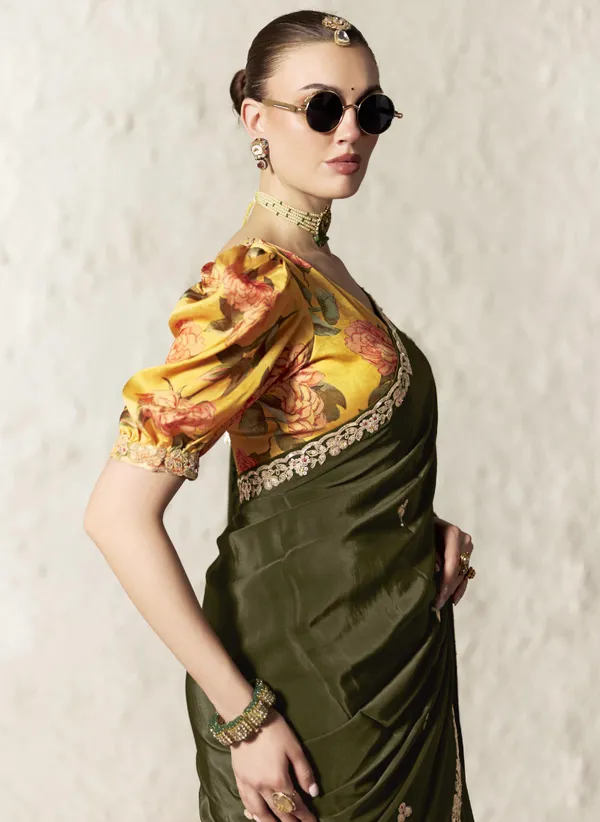 AN_EMBODIMENT_OF_UNDERSTATED_LUXURY,_THIS_SAREE_FEATURES_A_FLUID_DRAPE_AND_SOFT,_LUMINOUS_FINISH_,_ITS_ELEGANT_TEXTURE_AND_REFINED_CRFTSMANSHIP_CREATE_A_SILHOUETTE_THAT_IS_EFFORTLESSLY_GRACEFUL_PREFECT_FOR_BOTH_GRAND_OCCASIONS_AND_INTIMATE_CELEBRATION