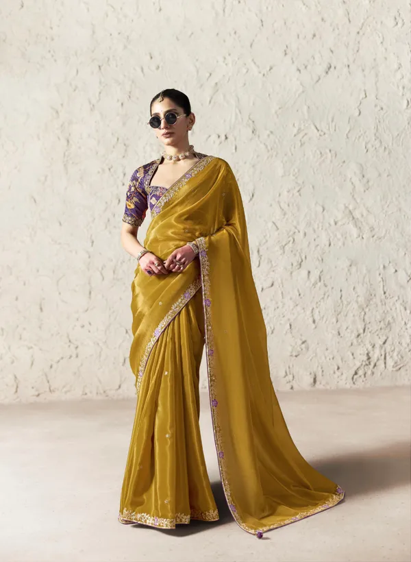 AN_EMBODIMENT_OF_UNDERSTATED_LUXURY,_THIS_SAREE_FEATURES_A_FLUID_DRAPE_AND_SOFT,_LUMINOUS_FINISH_,_ITS_ELEGANT_TEXTURE_AND_REFINED_CRFTSMANSHIP_CREATE_A_SILHOUETTE_THAT_IS_EFFORTLESSLY_GRACEFUL_PREFECT_FOR_BOTH_GRAND_OCCASIONS_AND_INTIMATE_CELEBRATION