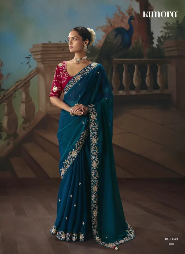 A_designer_work_saree_is_a_perfect_blend_of_tradition_and_contemporary_elegance._Crafted_with_intricate_embroidery,_shimmering_sequins,_delicate_zari,_and_fine_beadwork,_these_sarees_showcase_the_artistry_and_craftsmanship_of_skilled_designers.