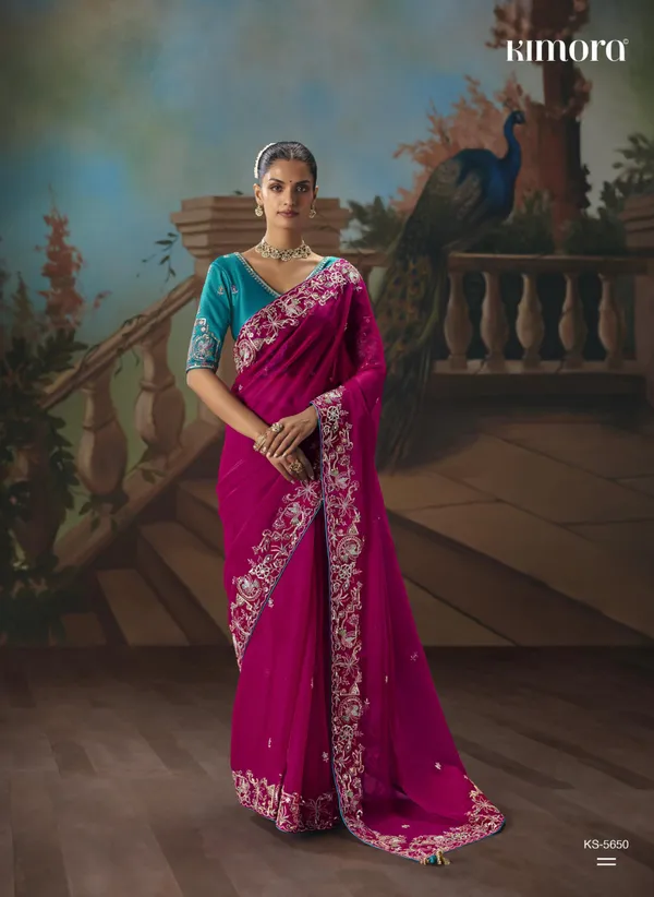 A_designer_work_saree_is_a_perfect_blend_of_tradition_and_contemporary_elegance._Crafted_with_intricate_embroidery,_shimmering_sequins,_delicate_zari,_and_fine_beadwork,_these_sarees_showcase_the_artistry_and_craftsmanship_of_skilled_designers.