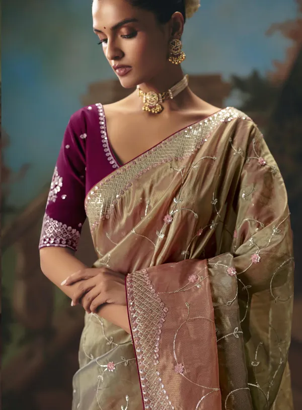 A_designer_work_saree_is_a_perfect_blend_of_tradition_and_contemporary_elegance._Crafted_with_intricate_embroidery,_shimmering_sequins,_delicate_zari,_and_fine_beadwork,_these_sarees_showcase_the_artistry_and_craftsmanship_of_skilled_designers.