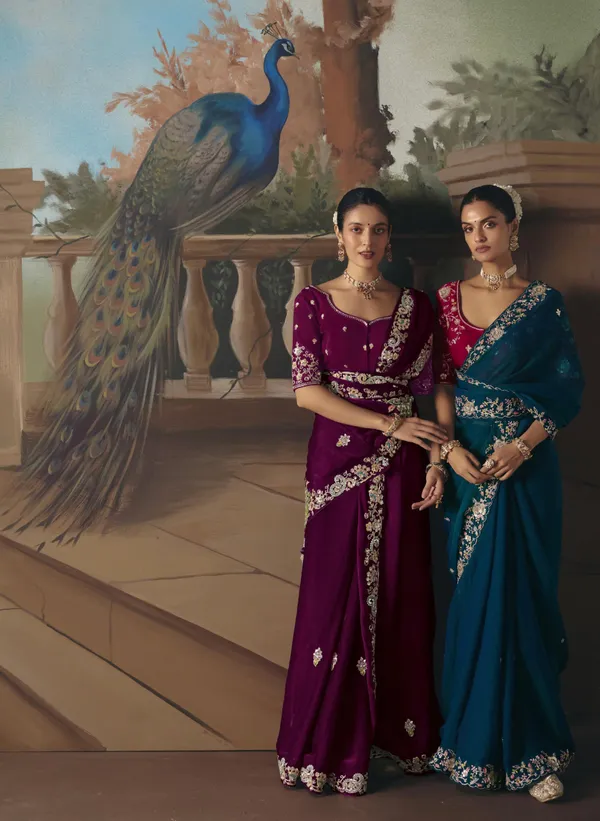 A_designer_work_saree_is_a_perfect_blend_of_tradition_and_contemporary_elegance._Crafted_with_intricate_embroidery,_shimmering_sequins,_delicate_zari,_and_fine_beadwork,_these_sarees_showcase_the_artistry_and_craftsmanship_of_skilled_designers.