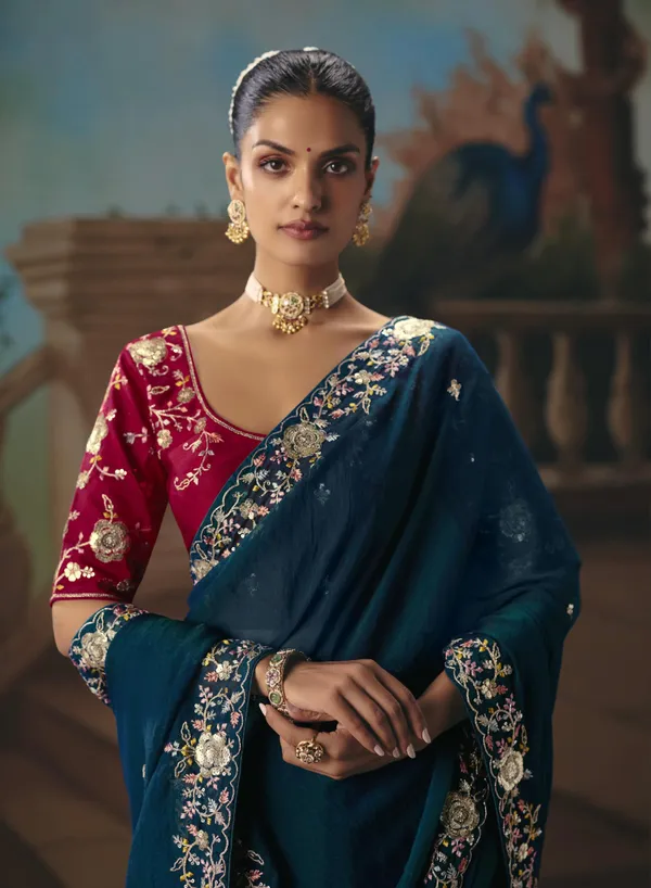 A_designer_work_saree_is_a_perfect_blend_of_tradition_and_contemporary_elegance._Crafted_with_intricate_embroidery,_shimmering_sequins,_delicate_zari,_and_fine_beadwork,_these_sarees_showcase_the_artistry_and_craftsmanship_of_skilled_designers.