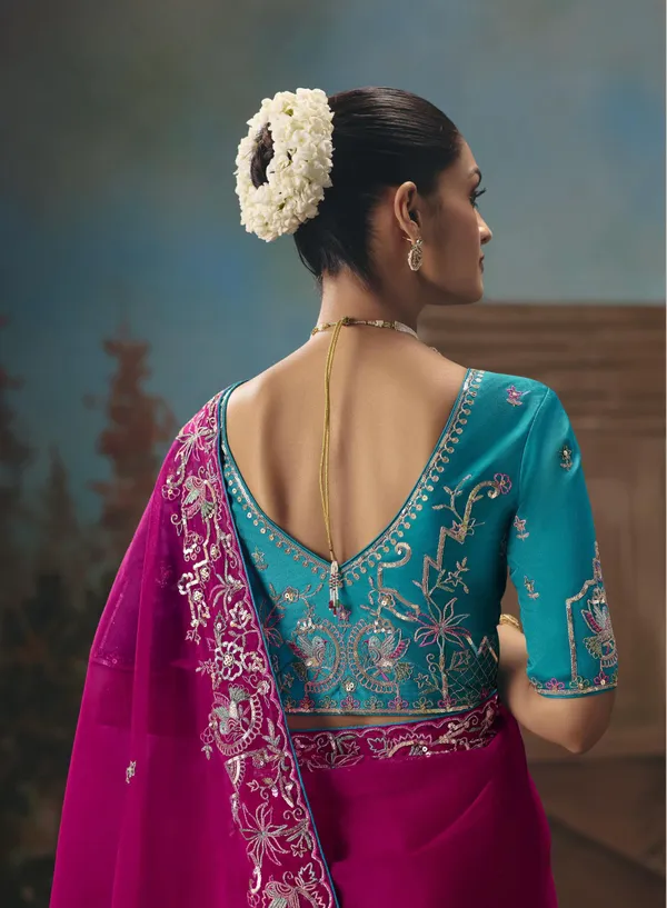 A_designer_work_saree_is_a_perfect_blend_of_tradition_and_contemporary_elegance._Crafted_with_intricate_embroidery,_shimmering_sequins,_delicate_zari,_and_fine_beadwork,_these_sarees_showcase_the_artistry_and_craftsmanship_of_skilled_designers.