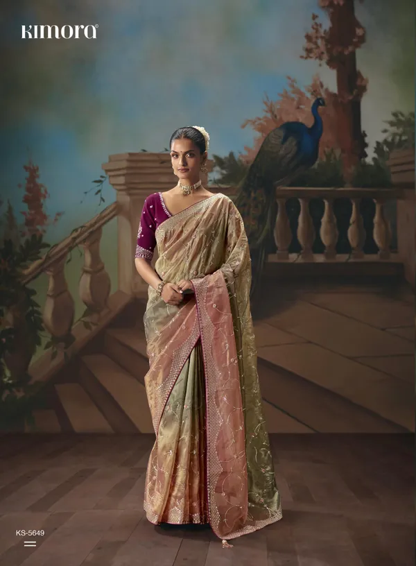 A_designer_work_saree_is_a_perfect_blend_of_tradition_and_contemporary_elegance._Crafted_with_intricate_embroidery,_shimmering_sequins,_delicate_zari,_and_fine_beadwork,_these_sarees_showcase_the_artistry_and_craftsmanship_of_skilled_designers.