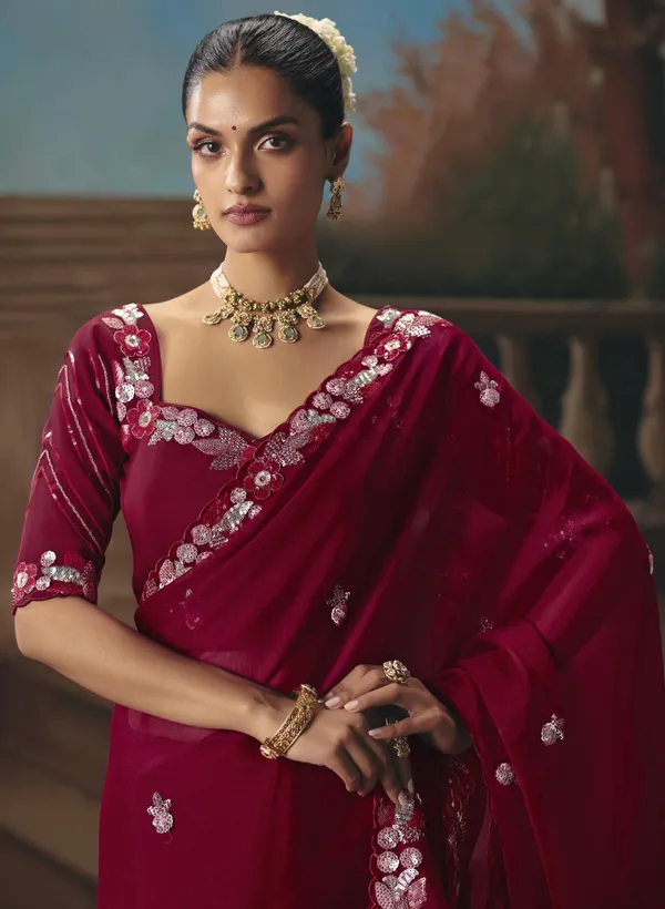 A_designer_work_saree_is_a_perfect_blend_of_tradition_and_contemporary_elegance._Crafted_with_intricate_embroidery,_shimmering_sequins,_delicate_zari,_and_fine_beadwork,_these_sarees_showcase_the_artistry_and_craftsmanship_of_skilled_designers.