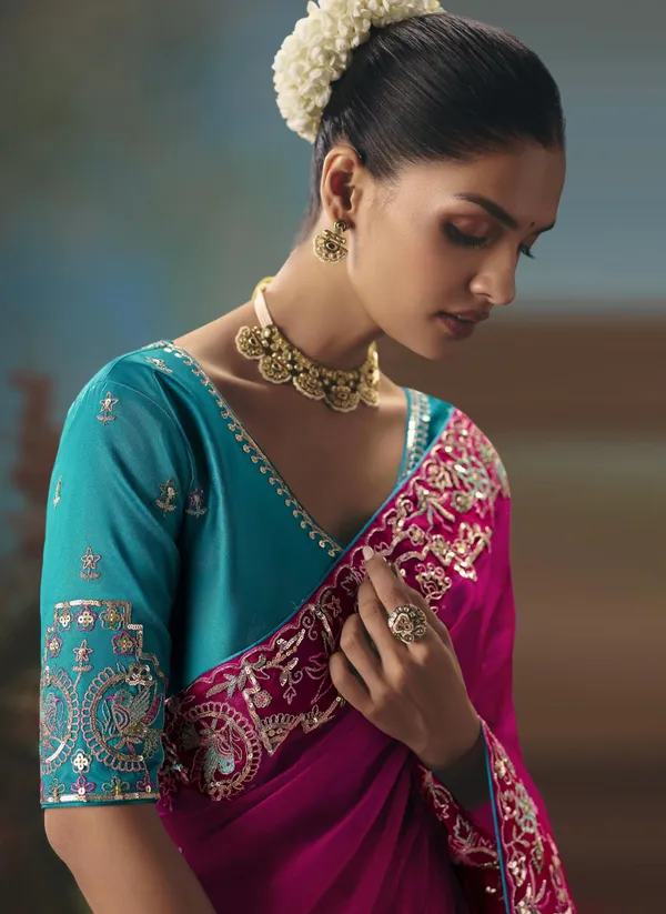 A_designer_work_saree_is_a_perfect_blend_of_tradition_and_contemporary_elegance._Crafted_with_intricate_embroidery,_shimmering_sequins,_delicate_zari,_and_fine_beadwork,_these_sarees_showcase_the_artistry_and_craftsmanship_of_skilled_designers.