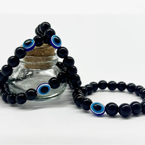 Black_Embrace_Protection_And_Style_With_Our_Handmade_Evil_Eye_Nazar_Bracelet_-_100%_Skin-Friendly,_Adjustable_Wristband_For_Women,_Men_And_Kids_(Set_Of_4)