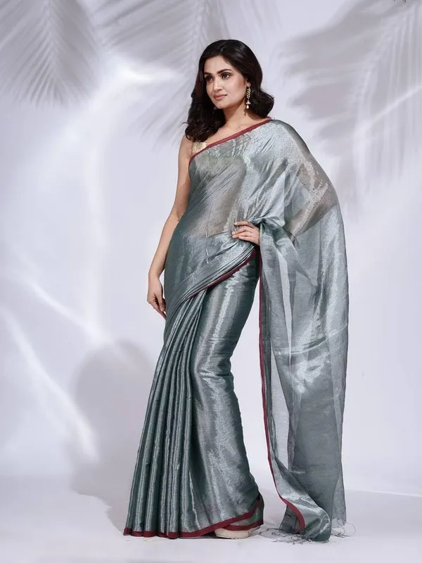 Grey_Handloom_Glossy_Tissue_Saree_With_Rich_Red_Border_Soft,_Lightweight_&_Lustrous_Finish_Perfect_For_Weddings,_Traditional_Elegance_Artisanal_Weaving_Masterpiece_For_Women